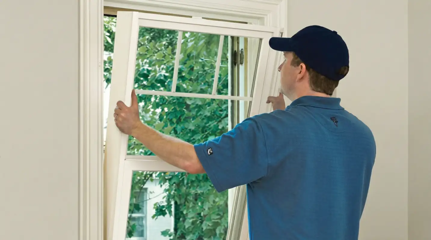 Professional contractors performing a residential window insulation and replacement service in Honolulu, HI